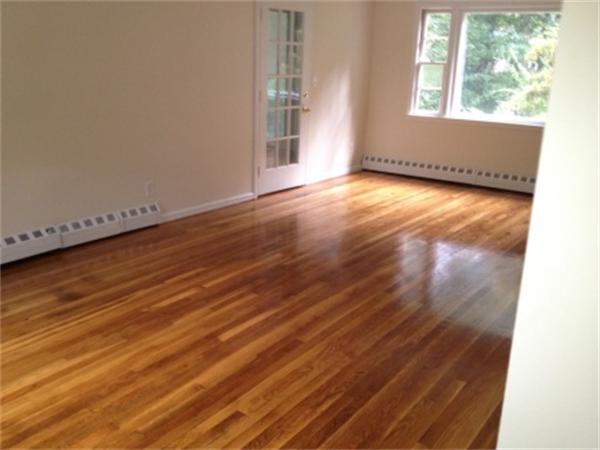 21 Howell Road Sudbury, MA 01776 - Photo 11 of 22 an empty room with wooden floor and windows