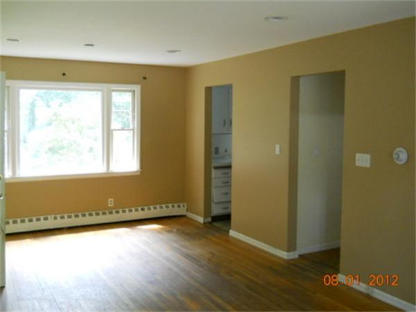 21 Howell Road Sudbury, MA 01776 - Photo 16 of 22 an empty room with wooden floor and windows