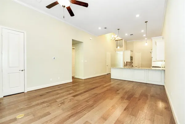 a view of a kitchen with wooden floor