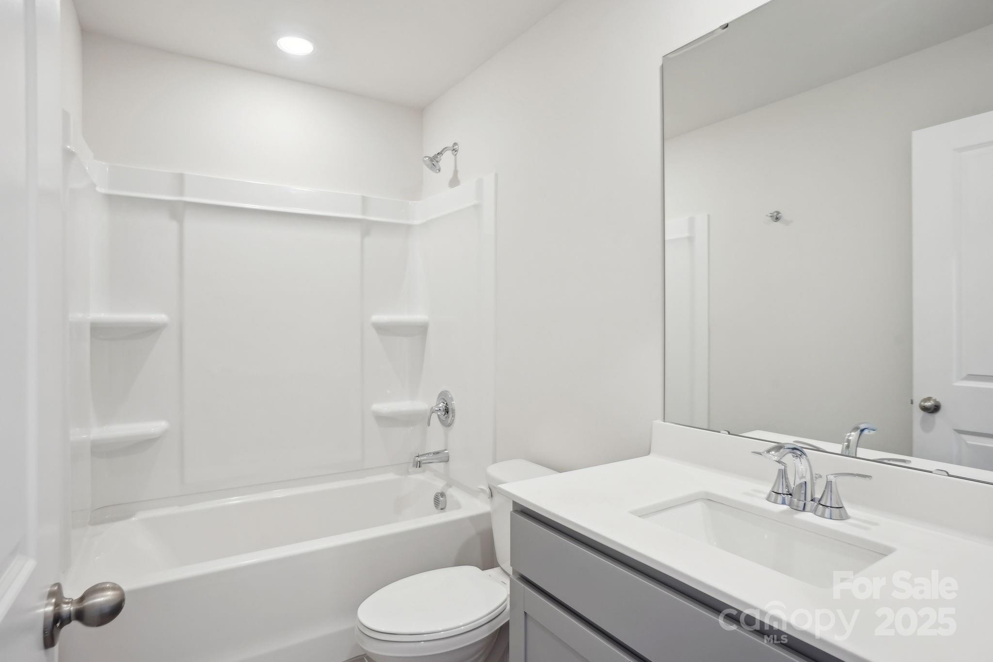 196 Murphy Mdw Road Mocksville, NC 27028 - Photo 15 of 24 a bathroom with a granite countertop sink toilet and shower