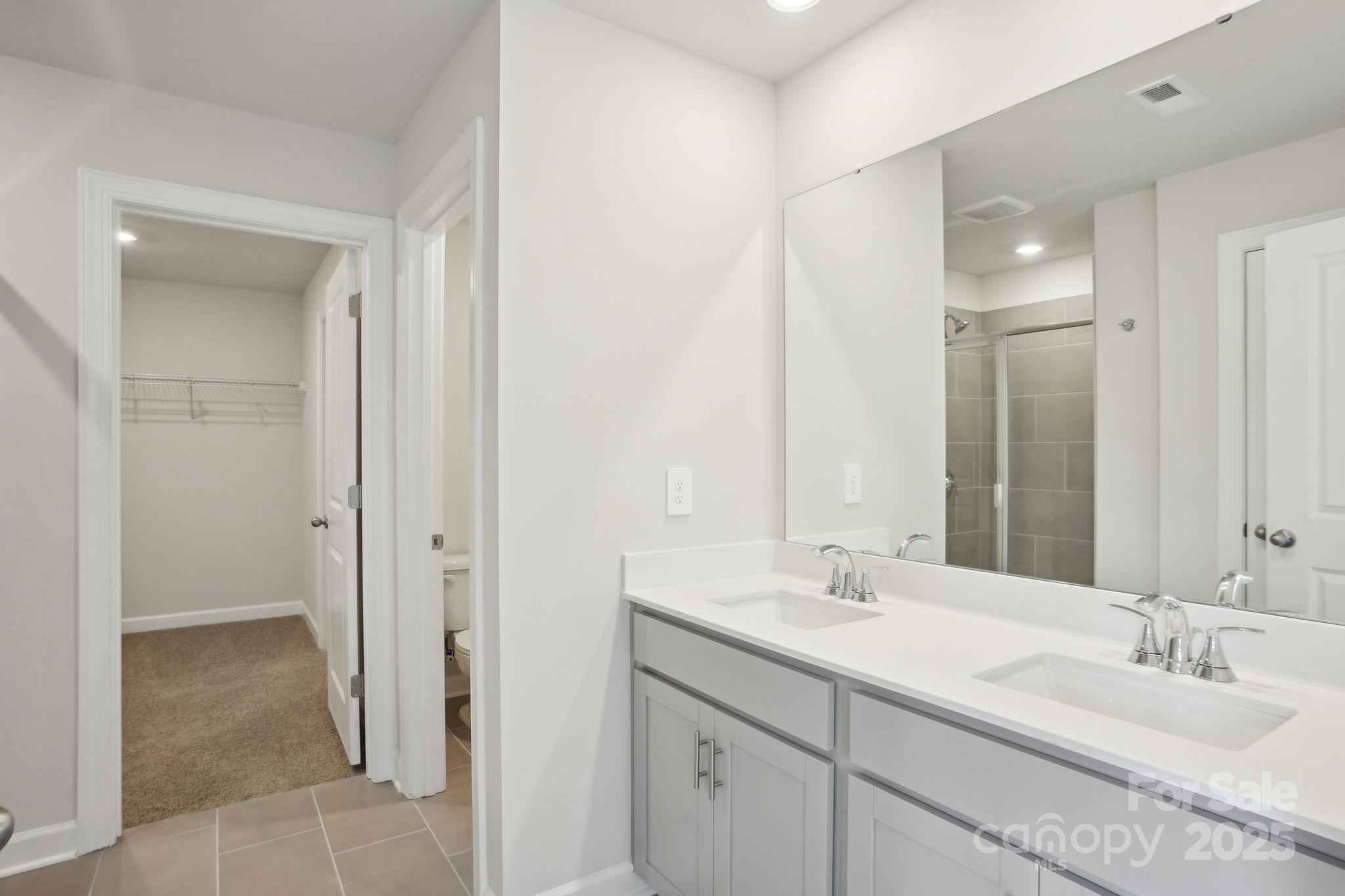 196 Murphy Mdw Road Mocksville, NC 27028 - Photo 20 of 24 a bathroom with a double vanity sink and a mirror