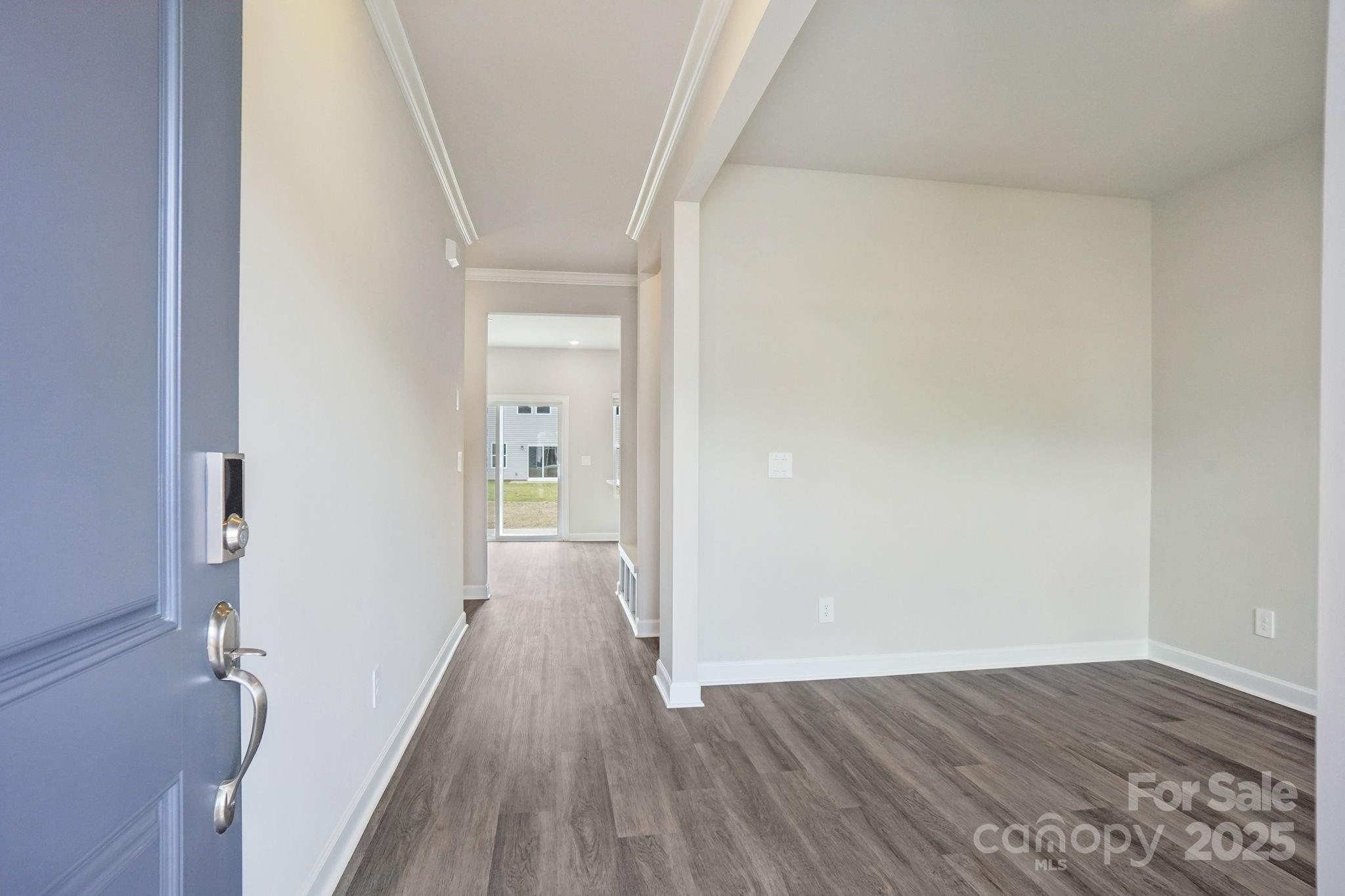 196 Murphy Mdw Road Mocksville, NC 27028 - Photo 2 of 24 a view of a hallway with wooden floor