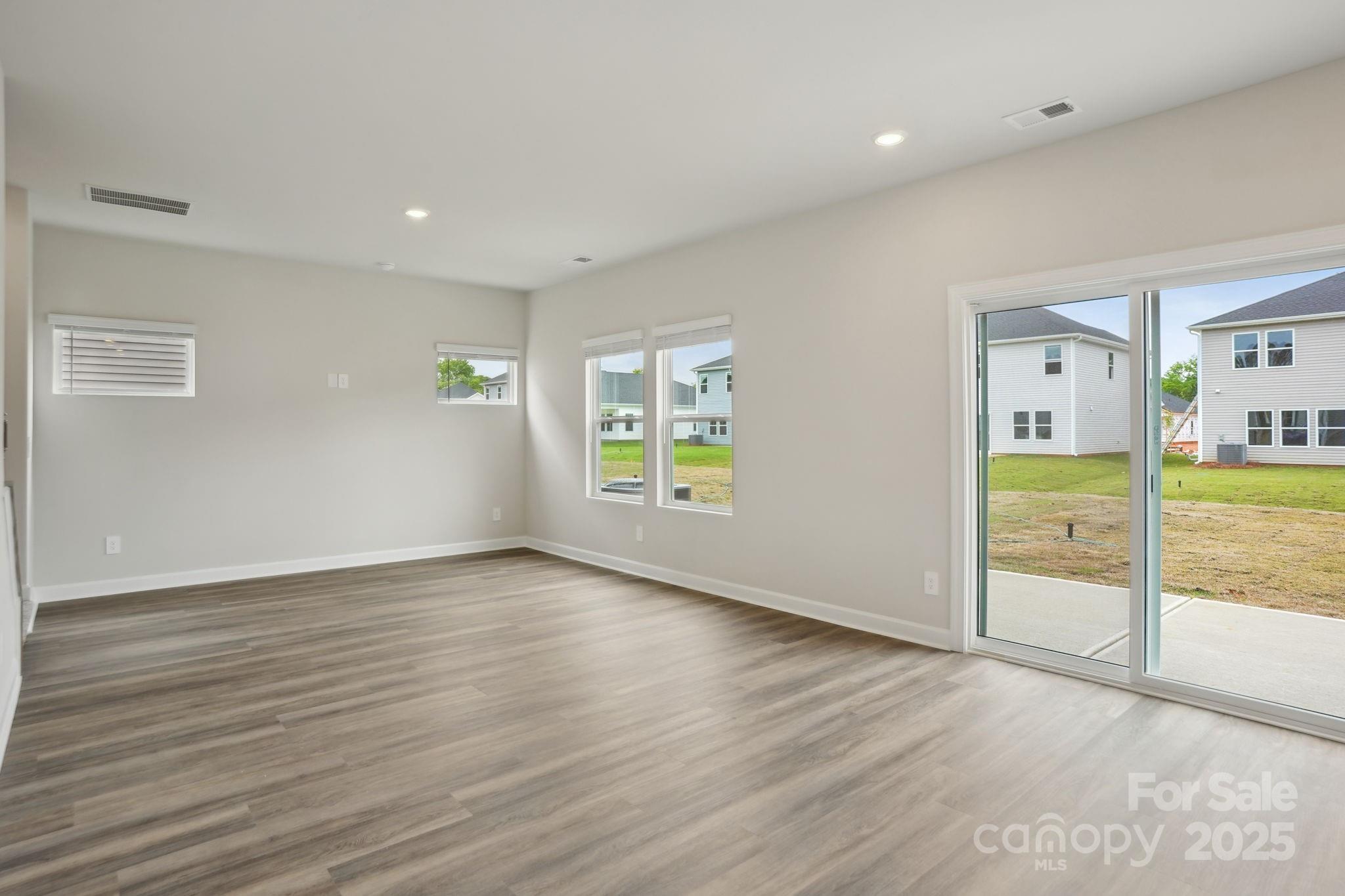 196 Murphy Mdw Road Mocksville, NC 27028 - Photo 6 of 24 wooden floor in an empty room with a window