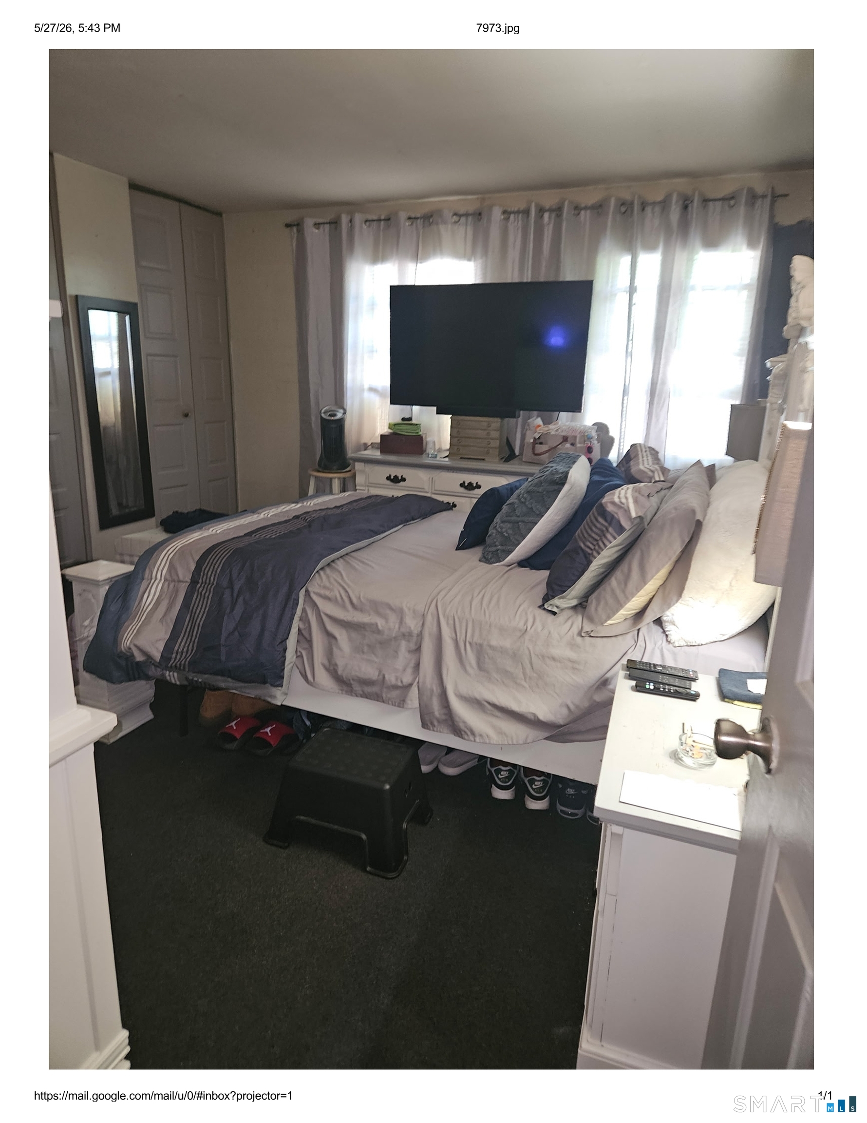 55 Angel Drive, Unit D Waterbury, CT 06708 - Photo 6 of 9 a bedroom with a bed and glass wall
