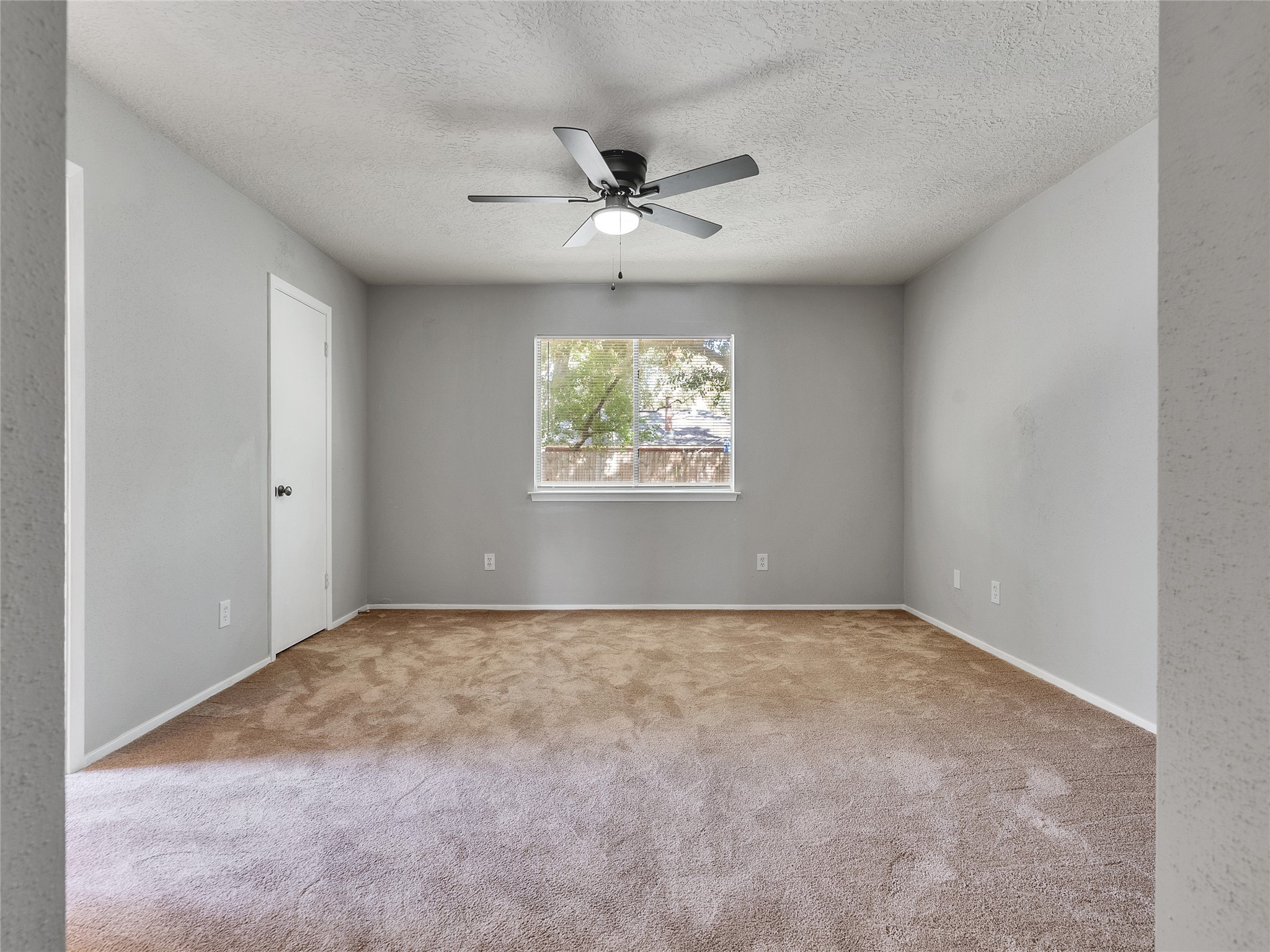 24006 Spring Gum Drive Spring, TX 77373 - Photo 15 of 31 an empty room with windows and ceiling fan