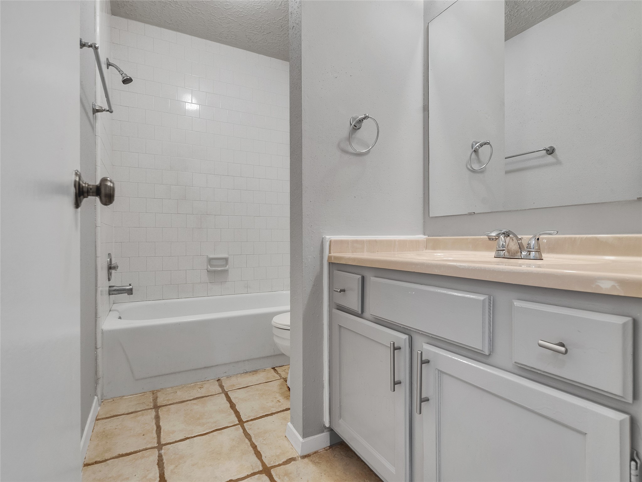 24006 Spring Gum Drive Spring, TX 77373 - Photo 21 of 31 a bathroom with a sink a vanity and a bathtub