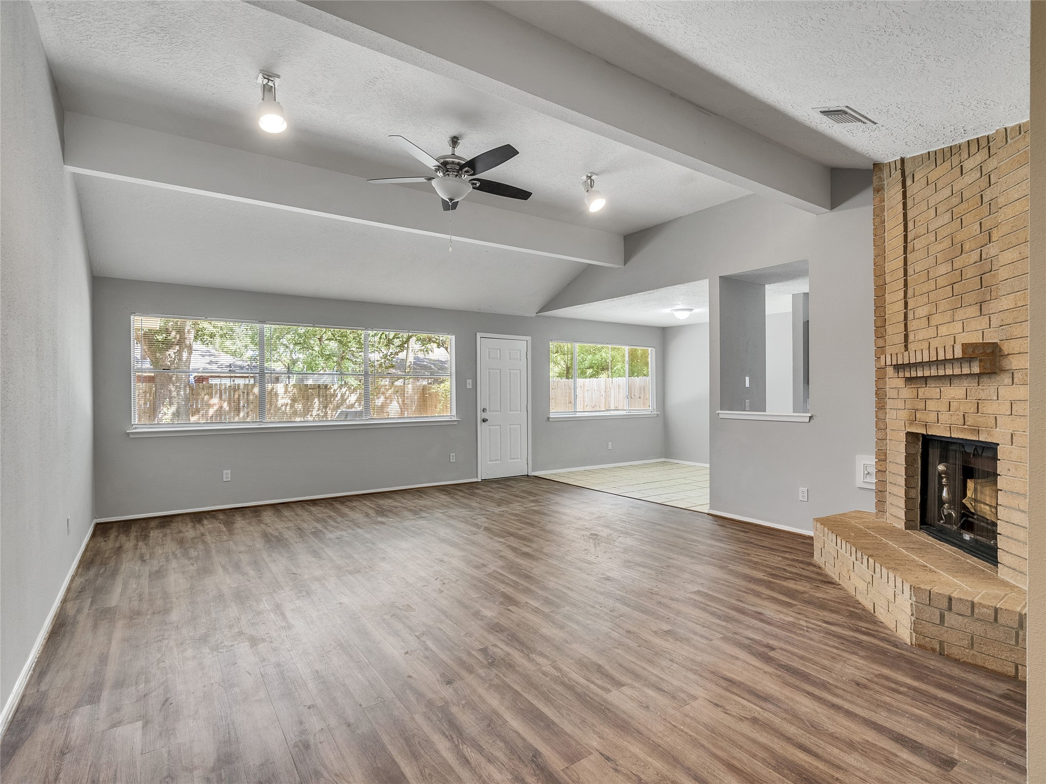 24006 Spring Gum Drive Spring, TX 77373 - Photo 3 of 31 a view of an empty room with a window and fireplace