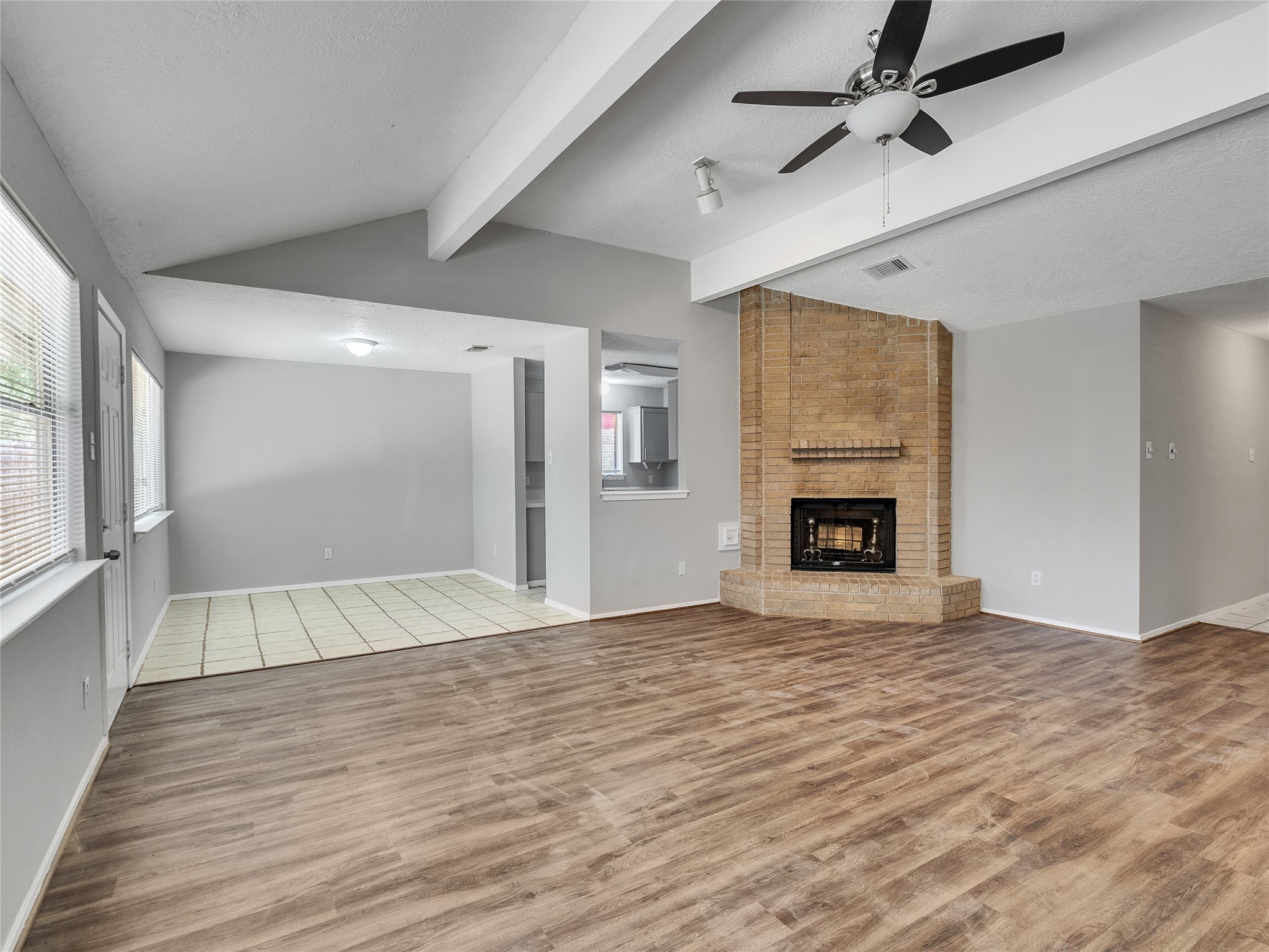 24006 Spring Gum Drive Spring, TX 77373 - Photo 4 of 31 a view of an empty room with wooden floor fireplace and a window