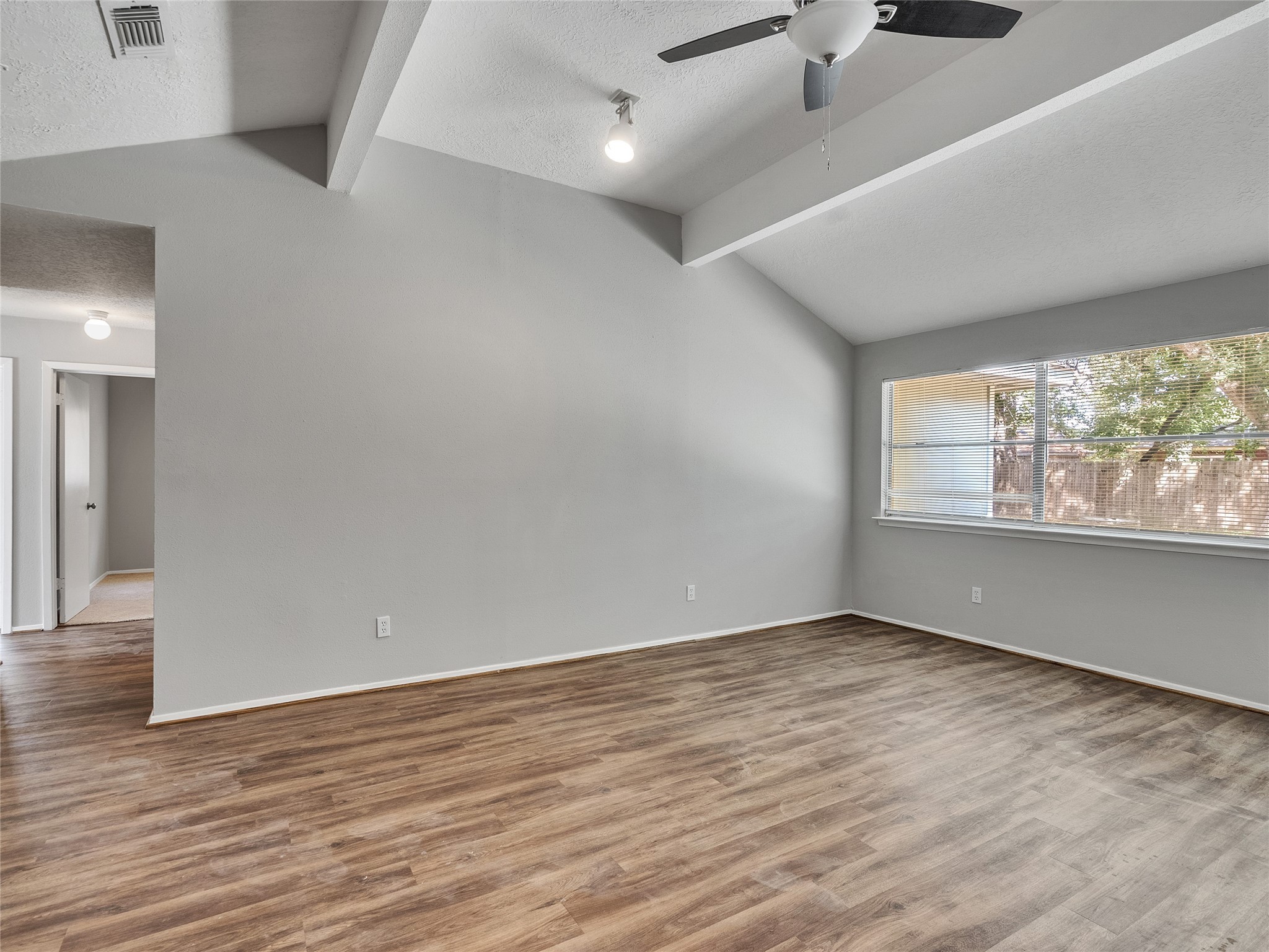 24006 Spring Gum Drive Spring, TX 77373 - Photo 6 of 31 wooden floor in an empty room with a window