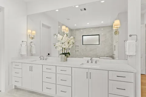 a bathroom with a sink a mirror and a