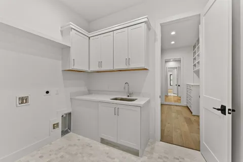 a view of a kitchen with electric appliances