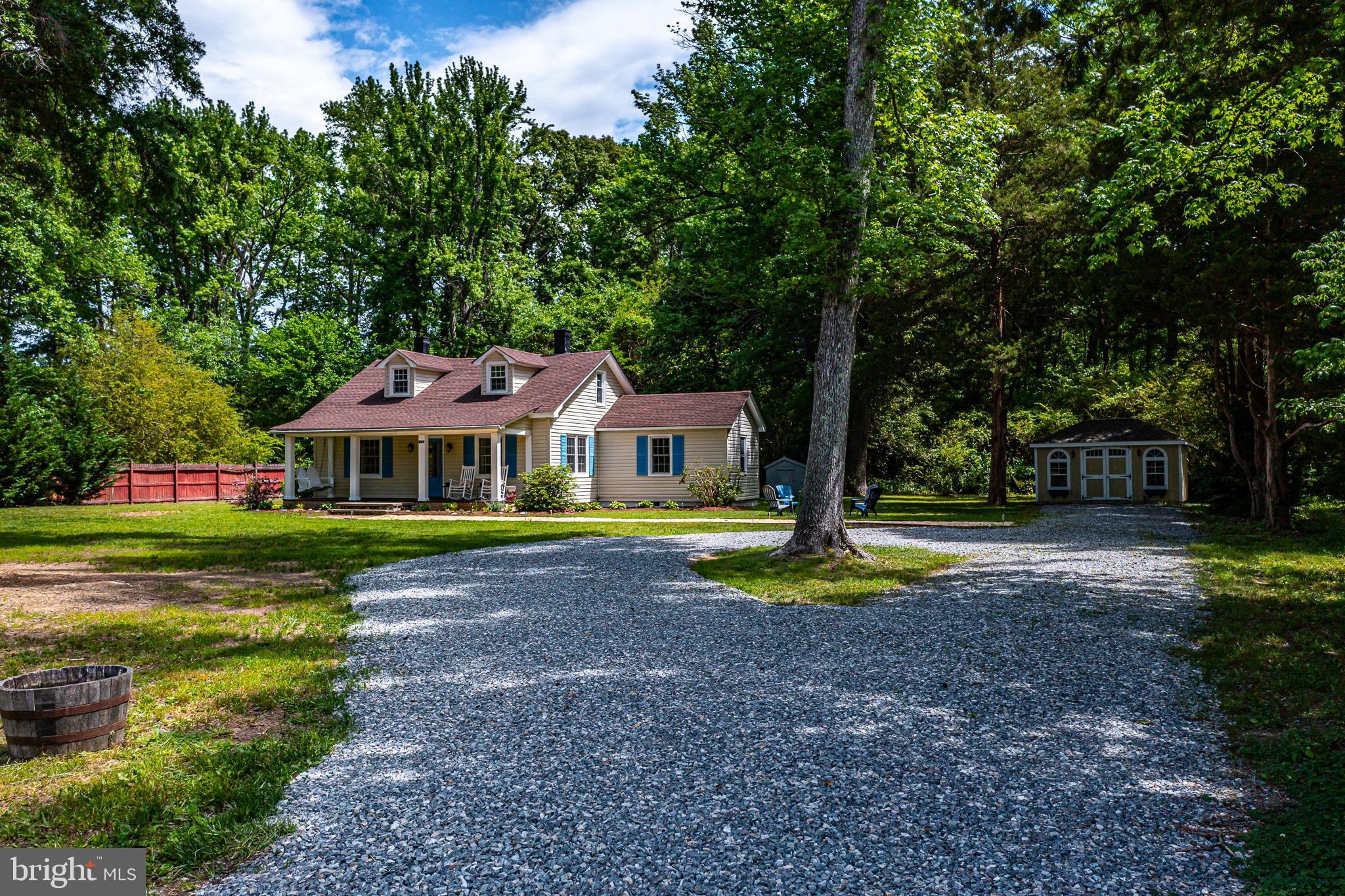 76 Tucker Hill Road Kinsale, VA 22488 - Photo 13 of 43 a front view of a house with garden
