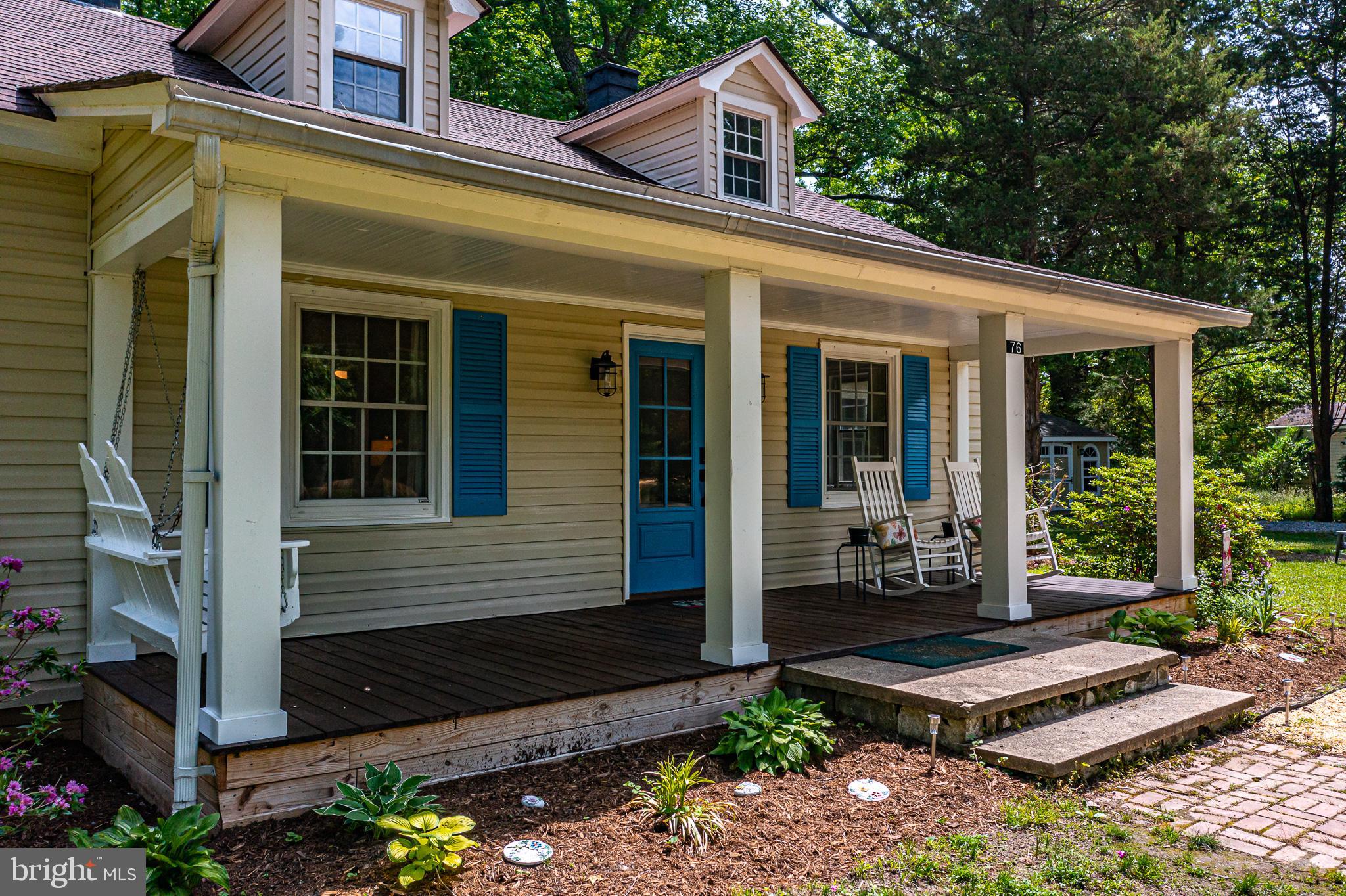 76 Tucker Hill Road Kinsale, VA 22488 - Photo 15 of 43 a front view of a house with a garden