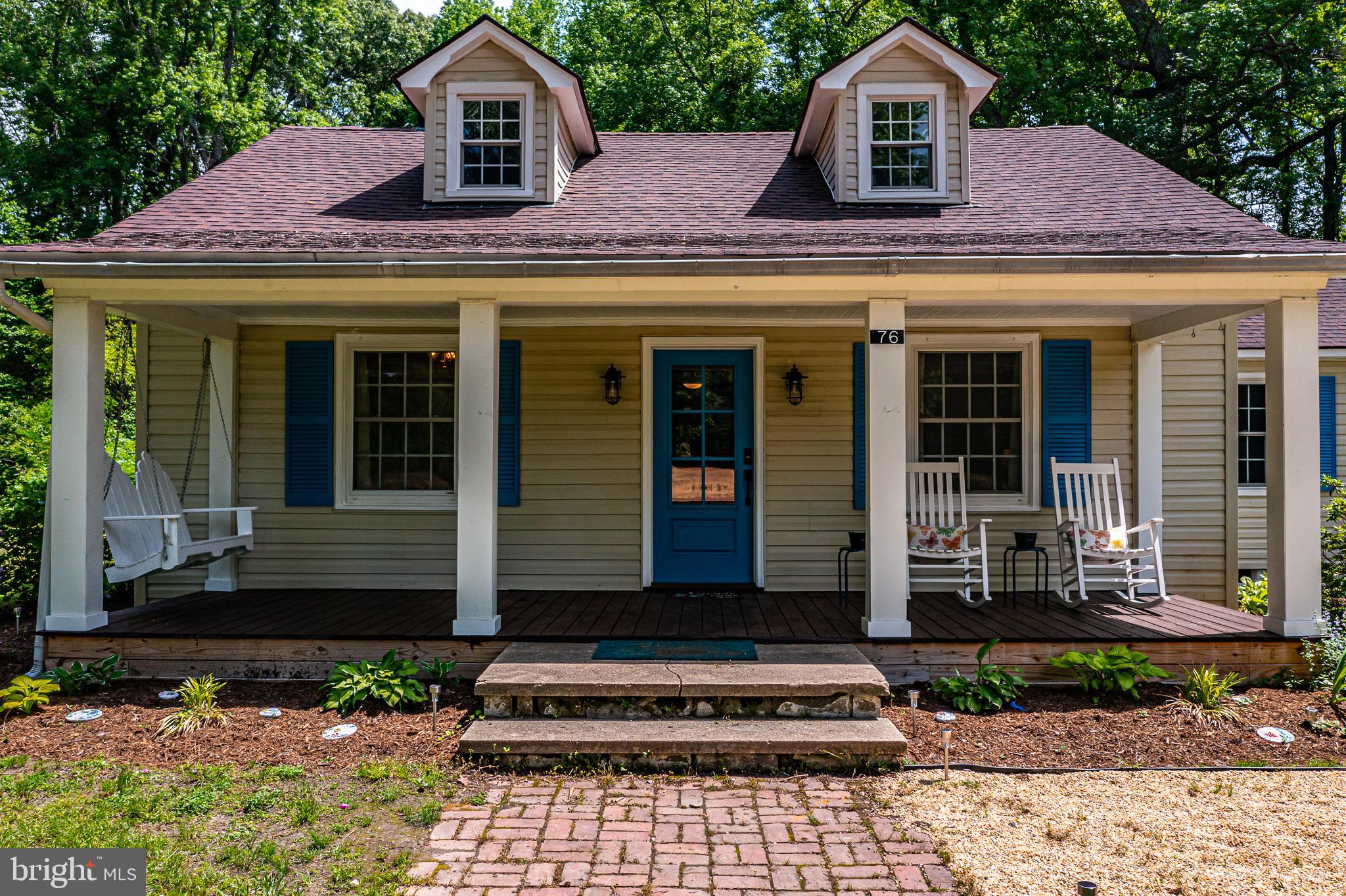 76 Tucker Hill Road Kinsale, VA 22488 - Photo 2 of 43 a front view of a house with garden