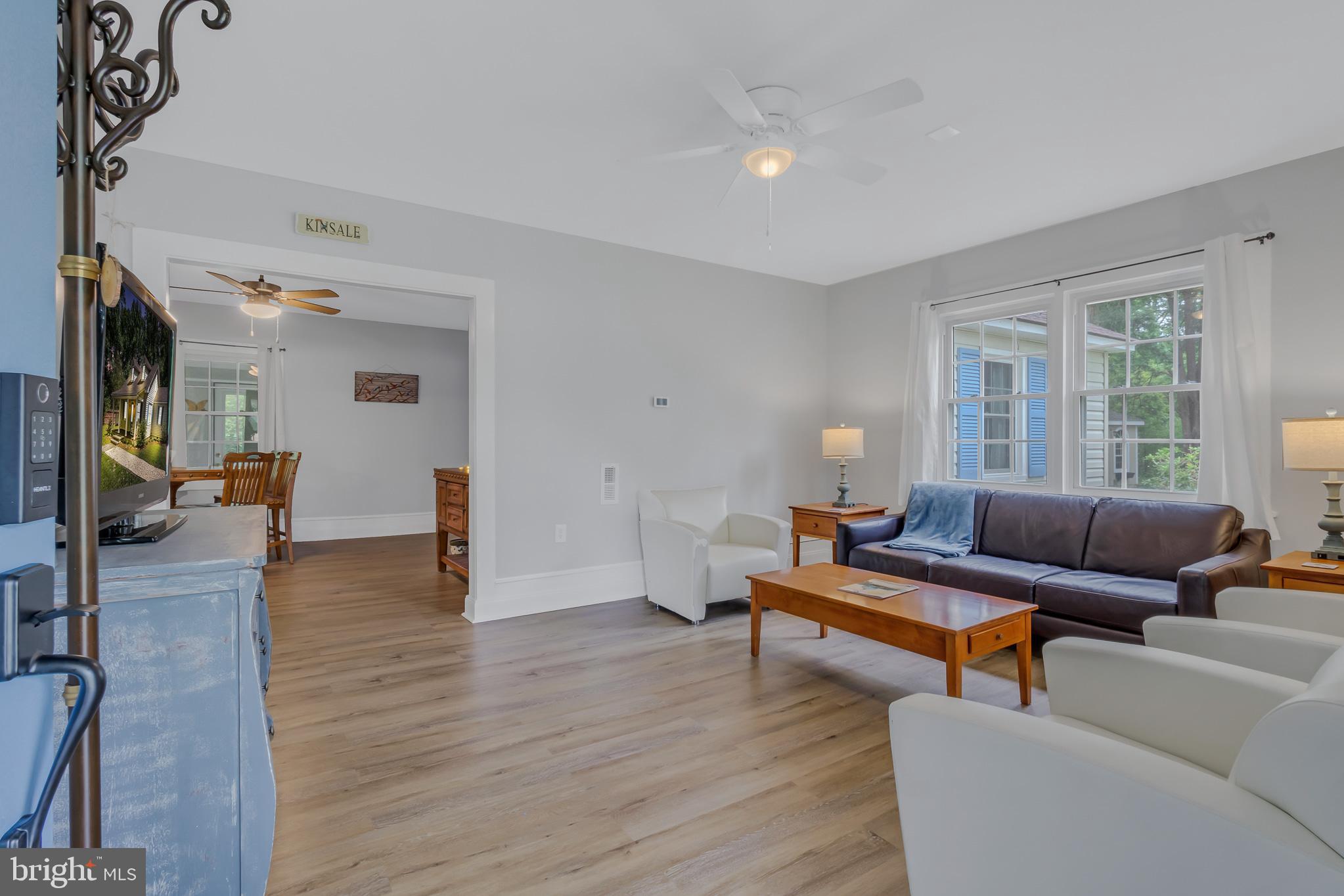76 Tucker Hill Road Kinsale, VA 22488 - Photo 22 of 43 a living room with furniture and a wooden floor