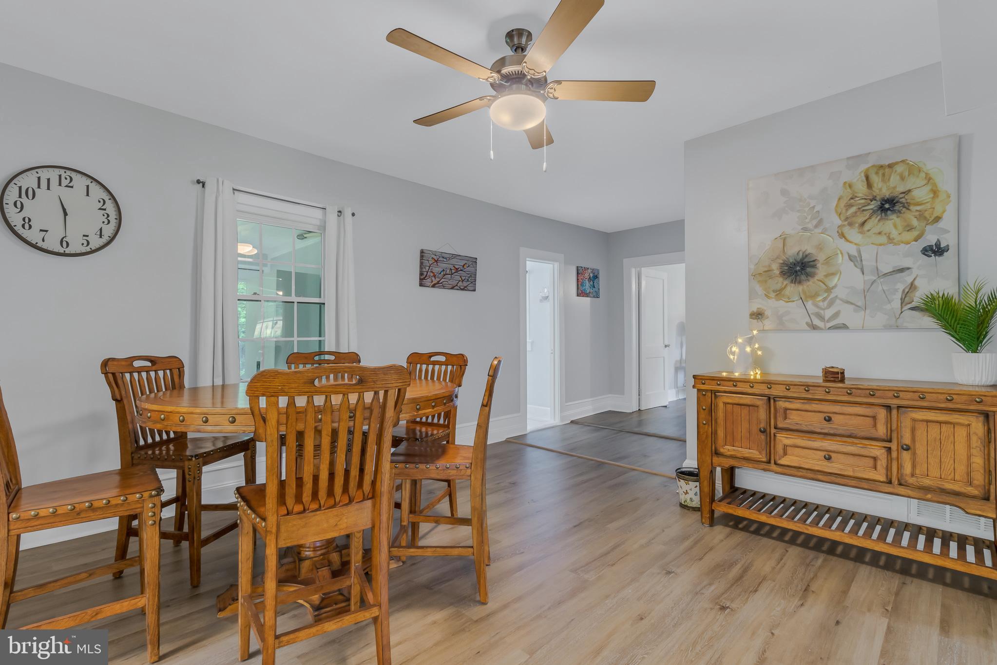 76 Tucker Hill Road Kinsale, VA 22488 - Photo 26 of 43 a view of a dining room with furniture and a chandelier fan