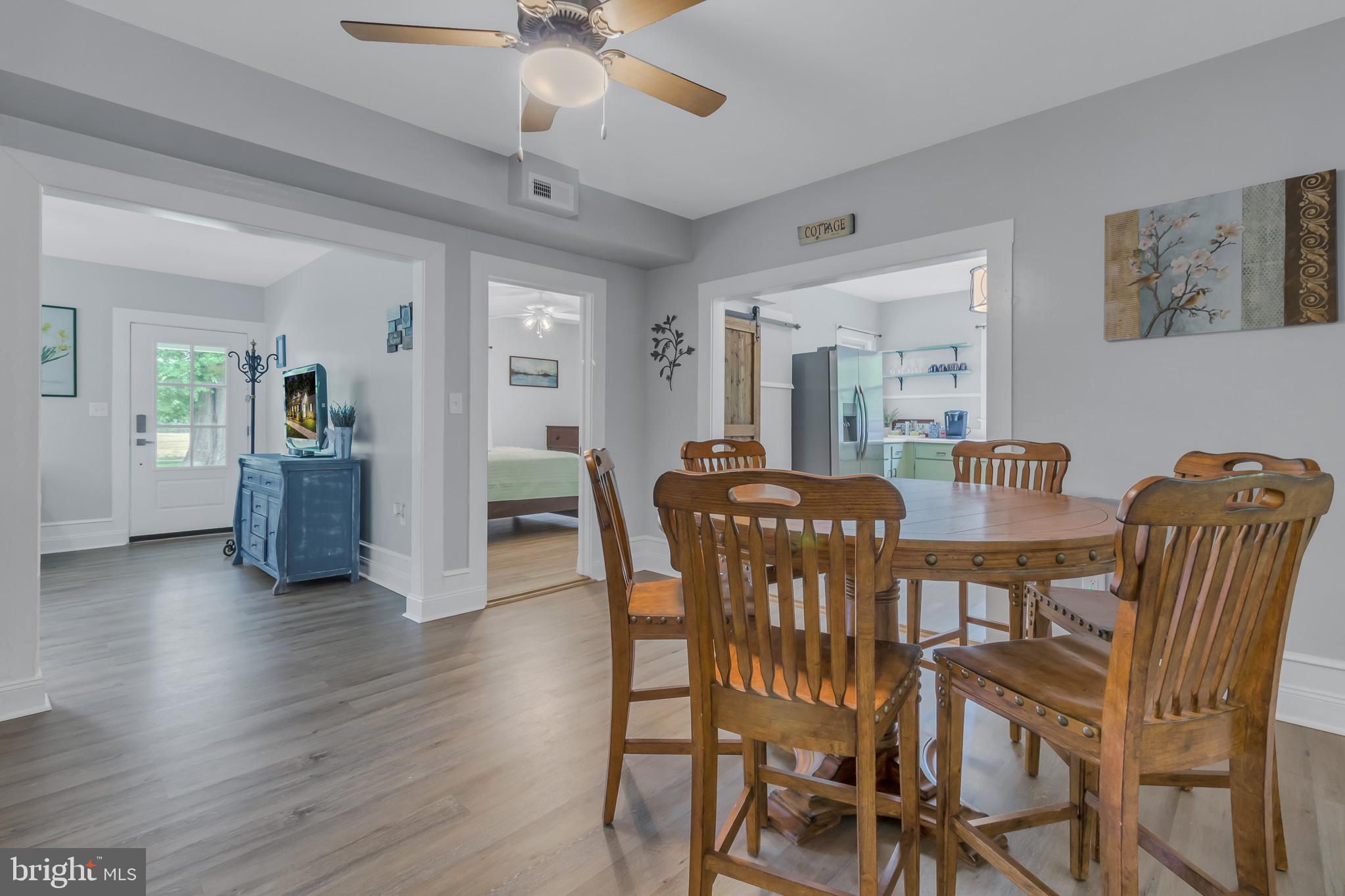 76 Tucker Hill Road Kinsale, VA 22488 - Photo 27 of 43 a view of a dining room with furniture and wooden floor