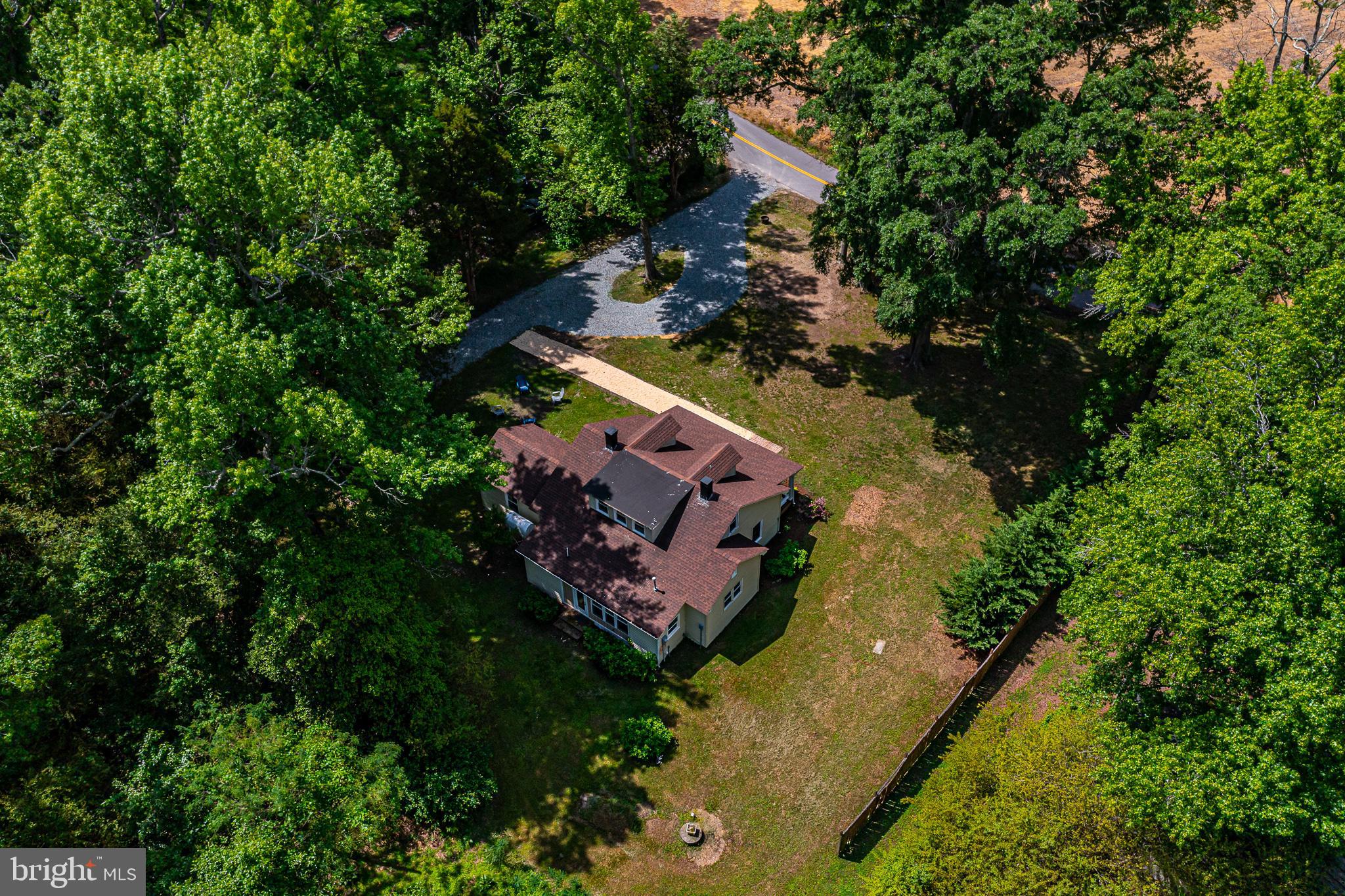 76 Tucker Hill Road Kinsale, VA 22488 - Photo 8 of 43 an aerial view of a house with a yard and lake view