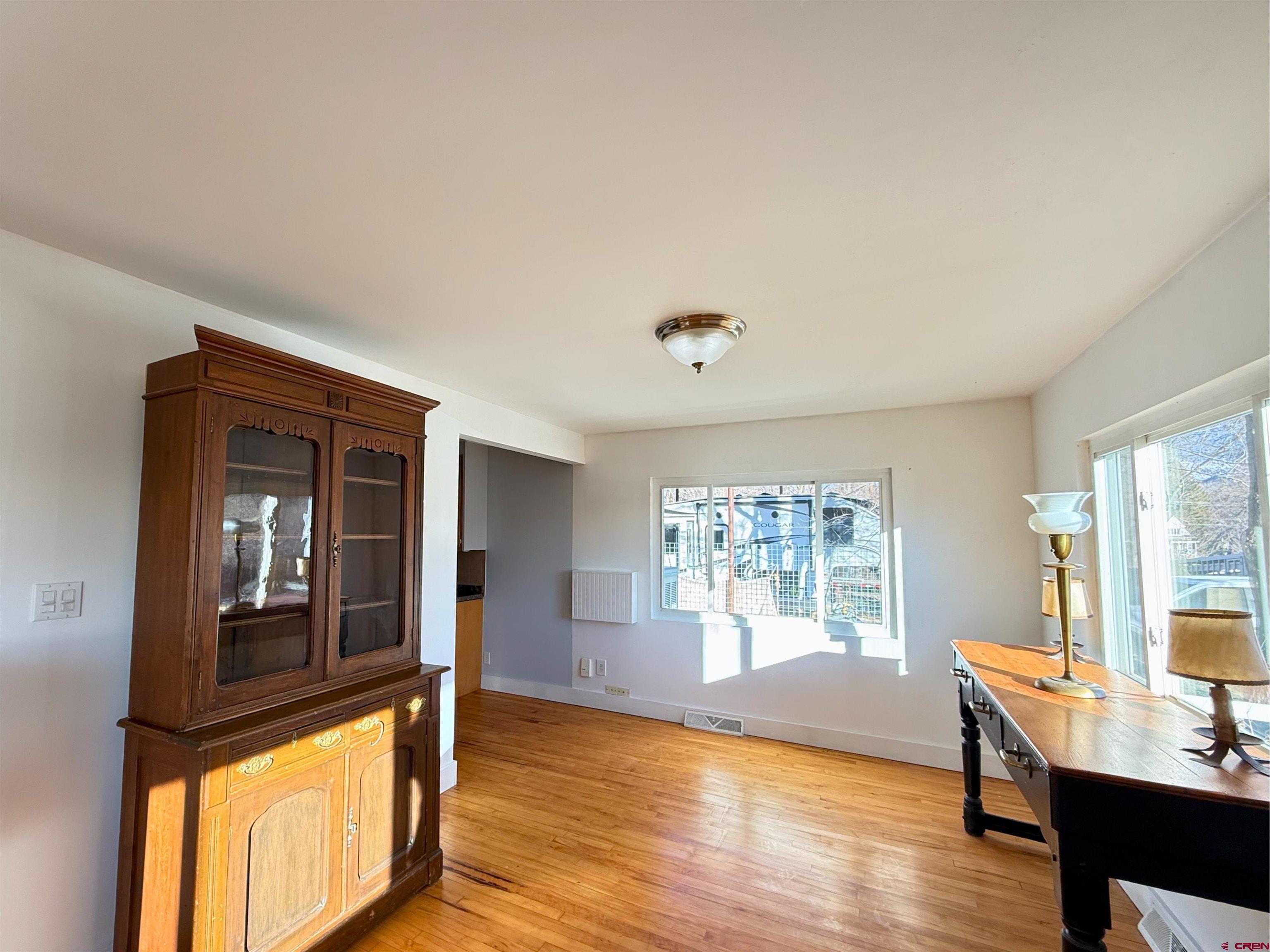 458 Price Road Paonia, CO 81428 - Photo 13 of 44 a view of a livingroom with furniture wooden floor and windows
