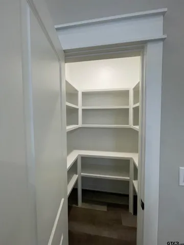 a storage room with washer and dryer