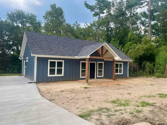 a front view of a house with yard