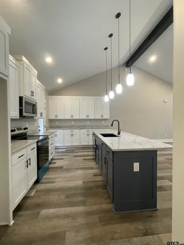 a kitchen with a sink and cabinets