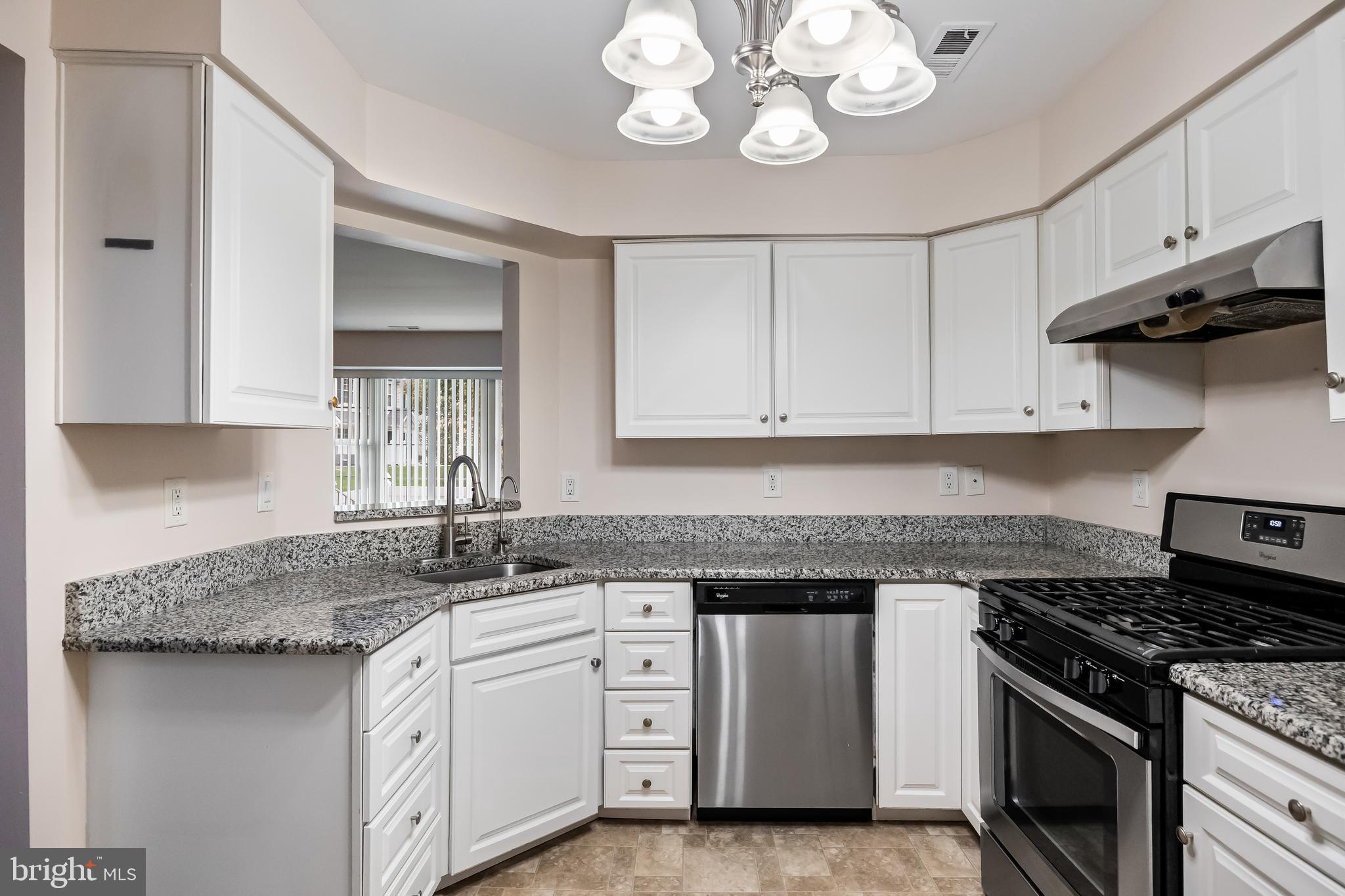 6206 Preston Way Mount Laurel, NJ 08054 - Photo 11 of 30 a kitchen with white cabinets and stainless steel appliances