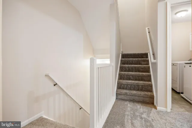 a view of a hallway with staircase