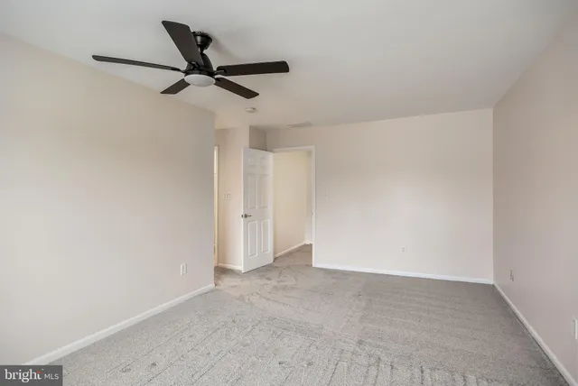 a view of a ceiling fan in a room