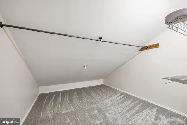 a view of a room with racks on the wall