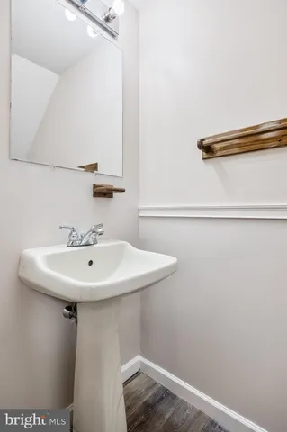 a bathroom with a sink and mirror