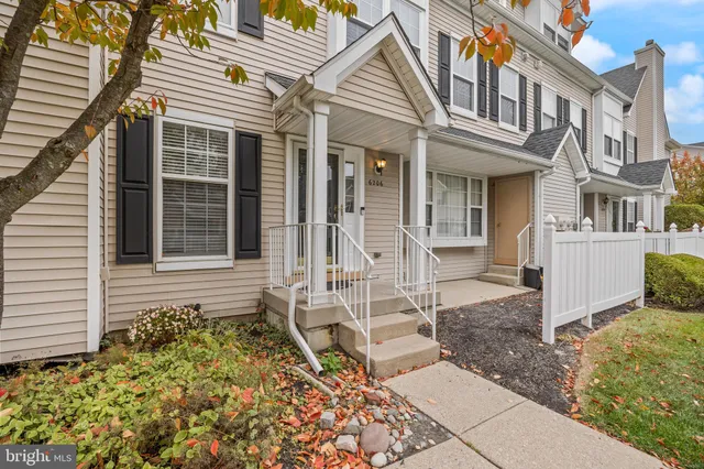 front view of a house with a large window