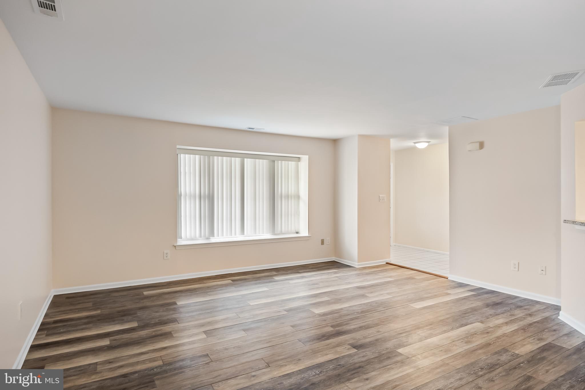 6206 Preston Way Mount Laurel, NJ 08054 - Photo 6 of 30 a view of an empty room with wooden floor and a window