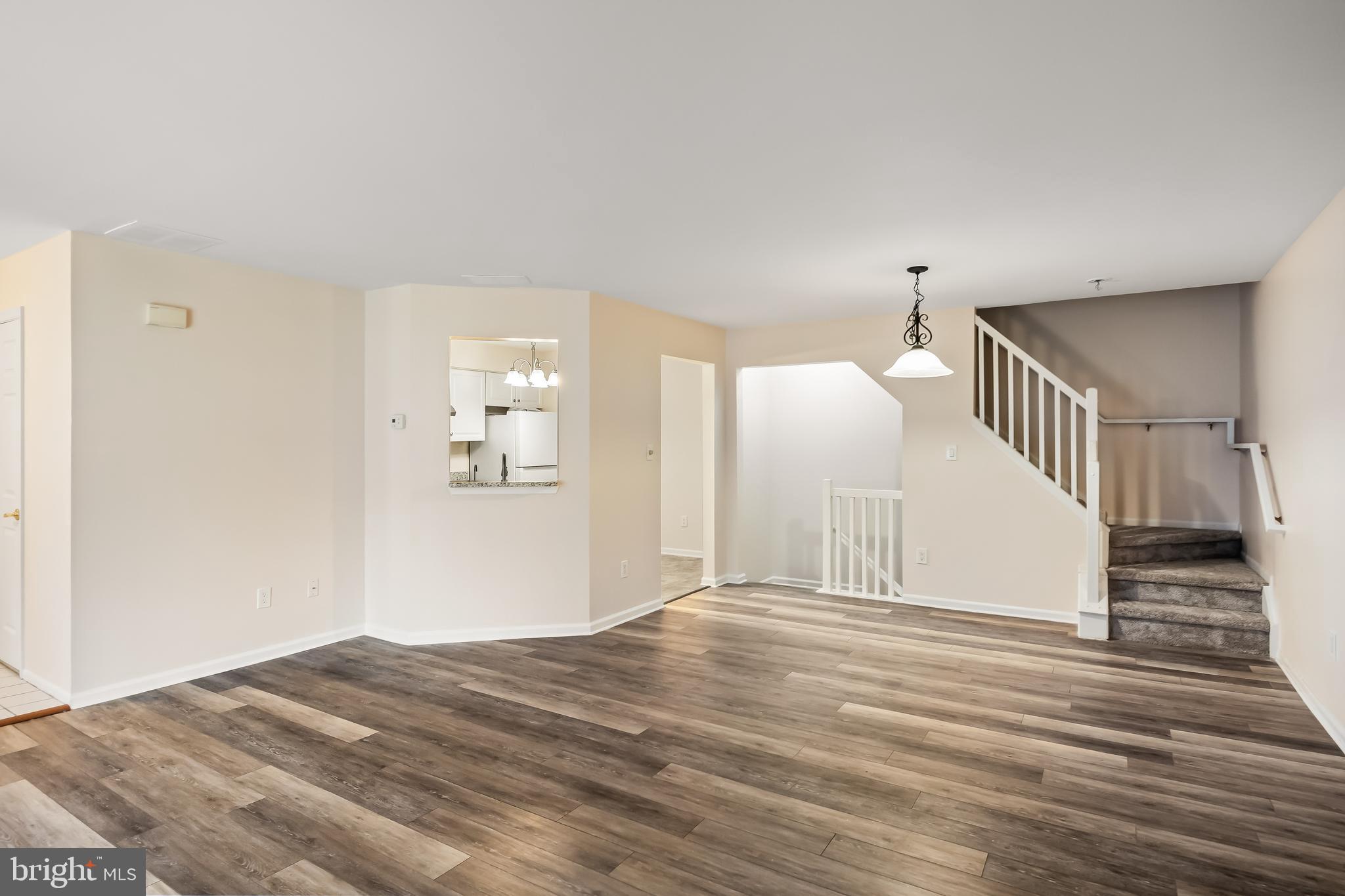 6206 Preston Way Mount Laurel, NJ 08054 - Photo 7 of 30 a view of a hallway with wooden floor and staircase