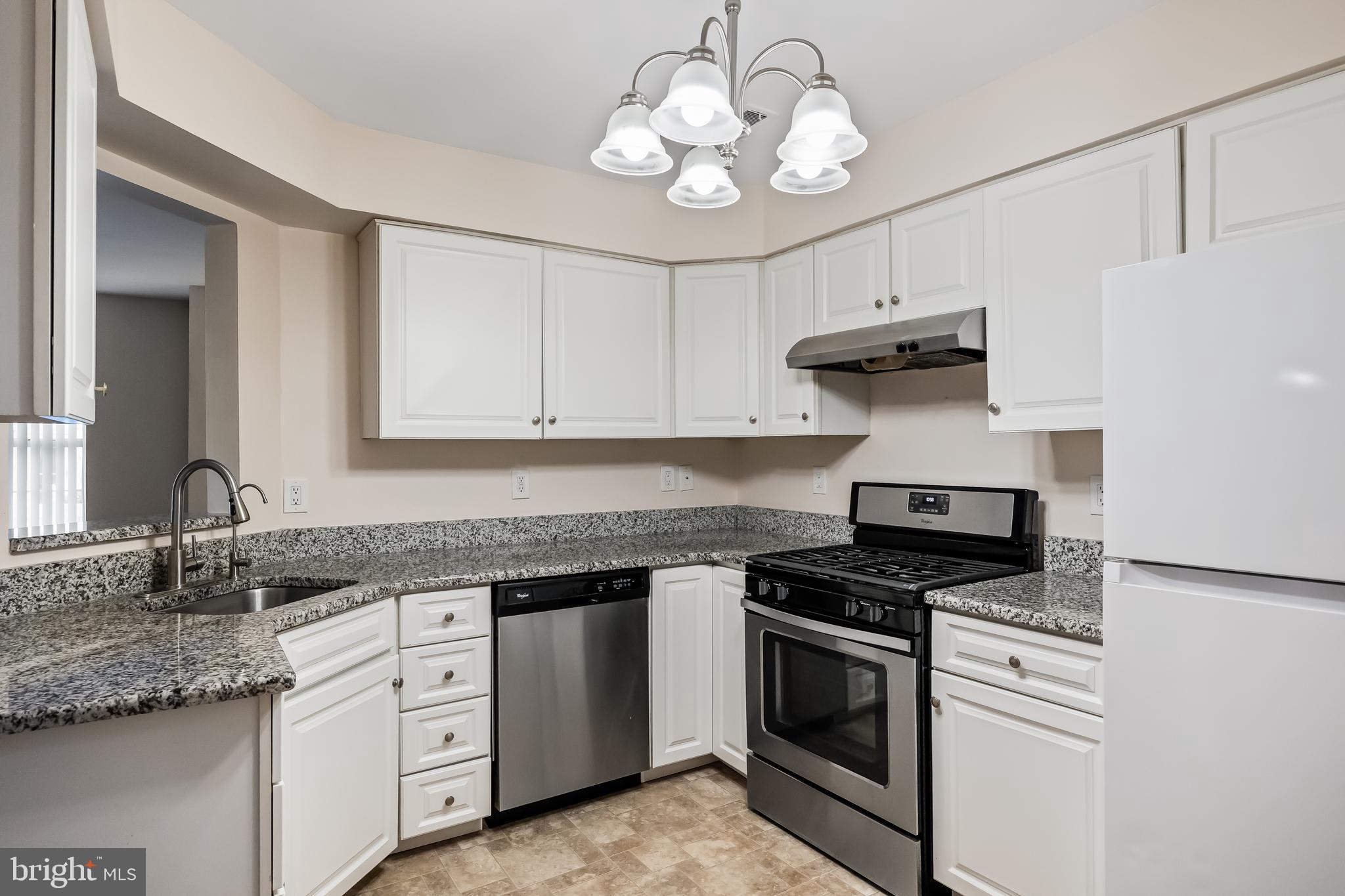 6206 Preston Way Mount Laurel, NJ 08054 - Photo 10 of 30 a kitchen with granite countertop stainless steel appliances a stove sink and cabinets