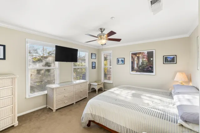 a bedroom with bed and window