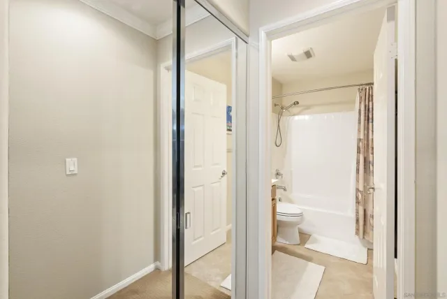 a bathroom with a glass shower door