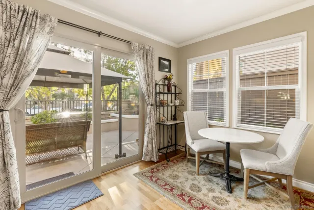 a view of a room with a table and chairs
