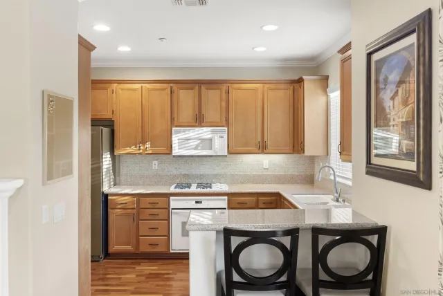 a utility room with sink dryer and washer