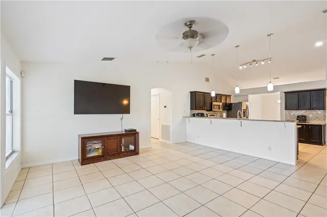 a view of living room with furniture and flat screen tv