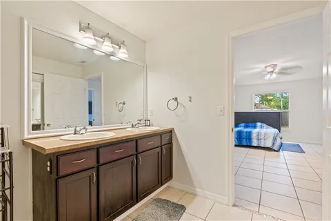 a bathroom with a black white checkered floor