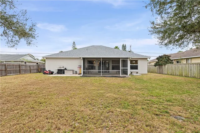 a house with swimming pool in front of it