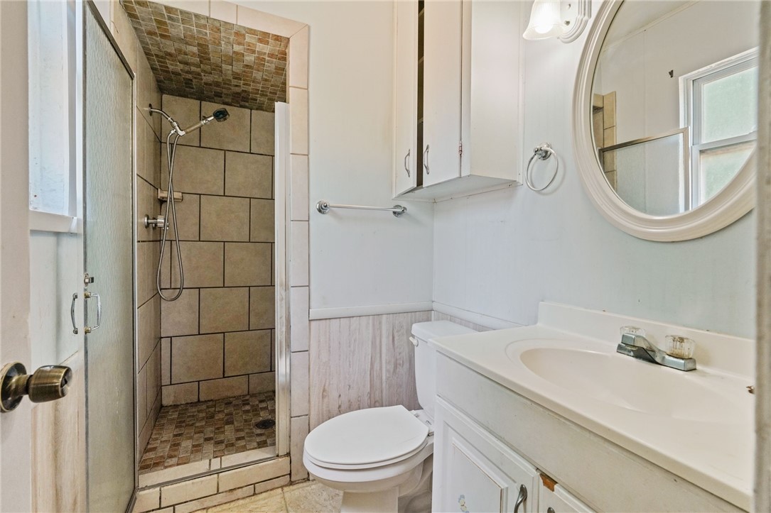 1806 Melisa Lane Corpus Christi, TX 78412 - Photo 11 of 13 a bathroom with a sink a toilet and shower