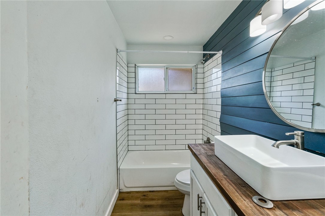 1806 Melisa Lane Corpus Christi, TX 78412 - Photo 7 of 13 a bathroom with a sink a toilet and shower