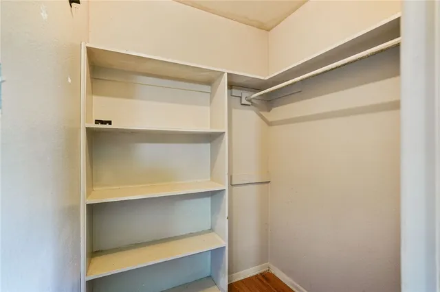 a view of an empty walk in closet