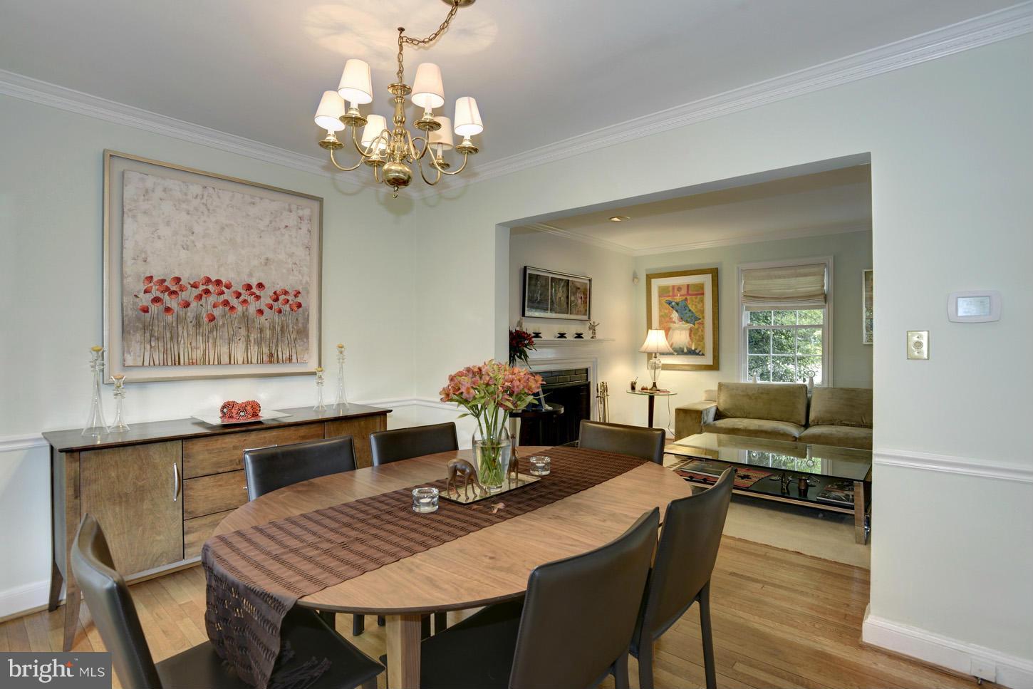 4625 Sedgwick Street Northwest Washington, DC 20016 - Photo 11 of 19 a view of a dining room with furniture a chandelier and wooden floor