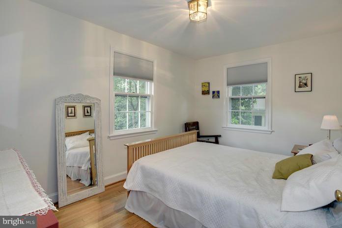 4625 Sedgwick Street Northwest Washington, DC 20016 - Photo 12 of 19 a bedroom with a bed and a window