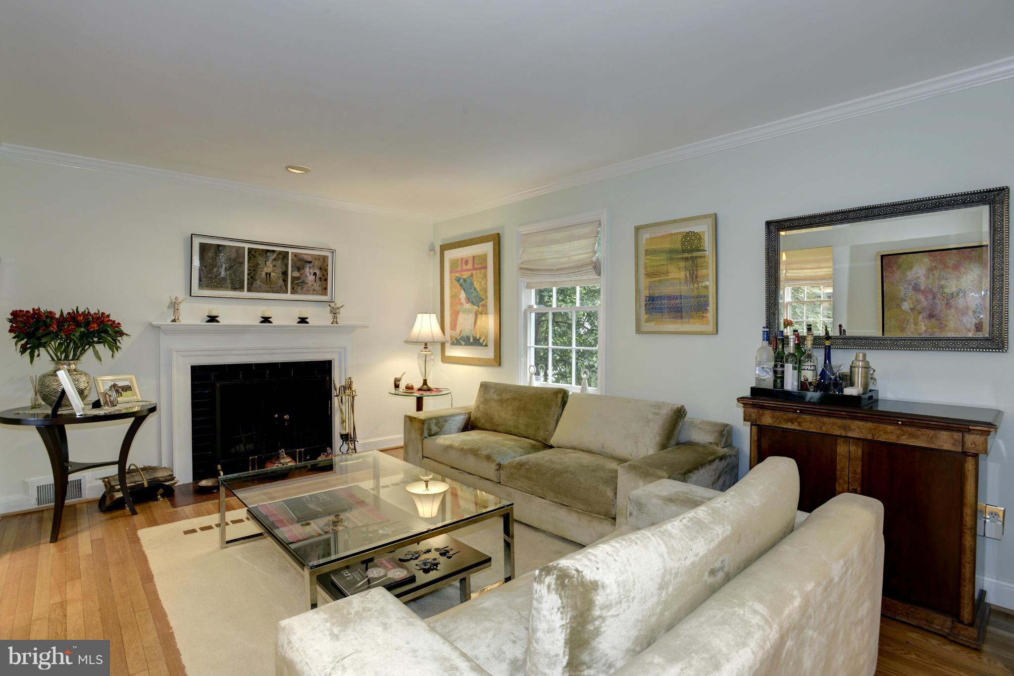 4625 Sedgwick Street Northwest Washington, DC 20016 - Photo 3 of 19 a living room with furniture and a fireplace