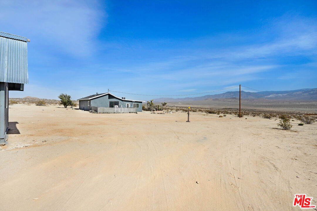 11170 Larkin Road Lucerne Valley, CA 92356 - Photo 2 of 14 a view of a terrace of a building