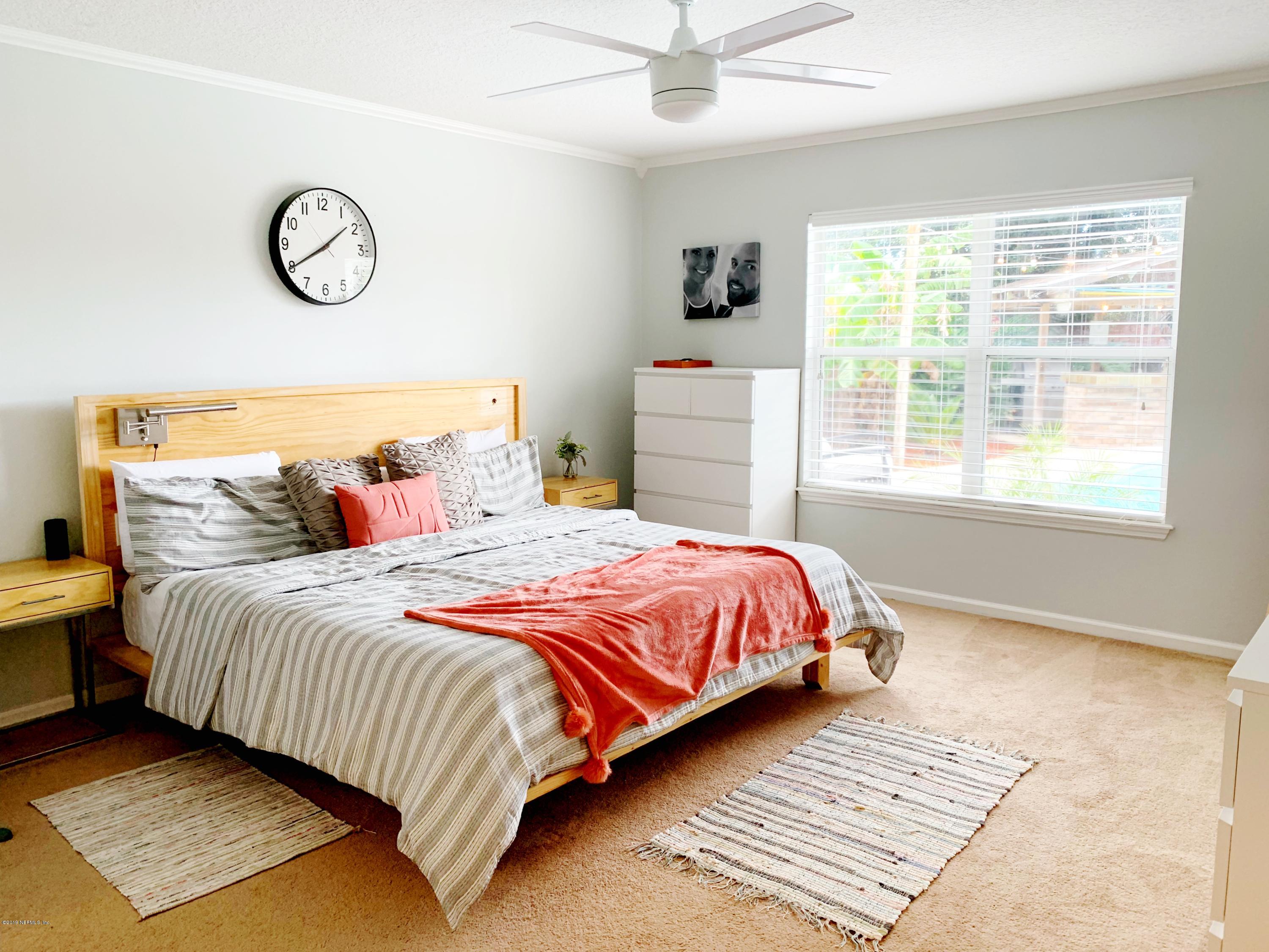 10345 Sugar Grove Road Jacksonville, FL 32221 - Photo 23 of 36 a bedroom with a bed and window